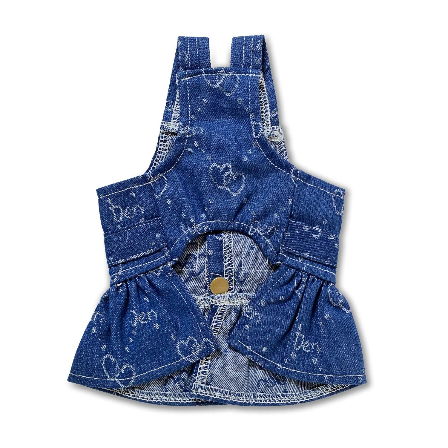 Dog wearing heart-print denim dress harness for stylish and secure walks