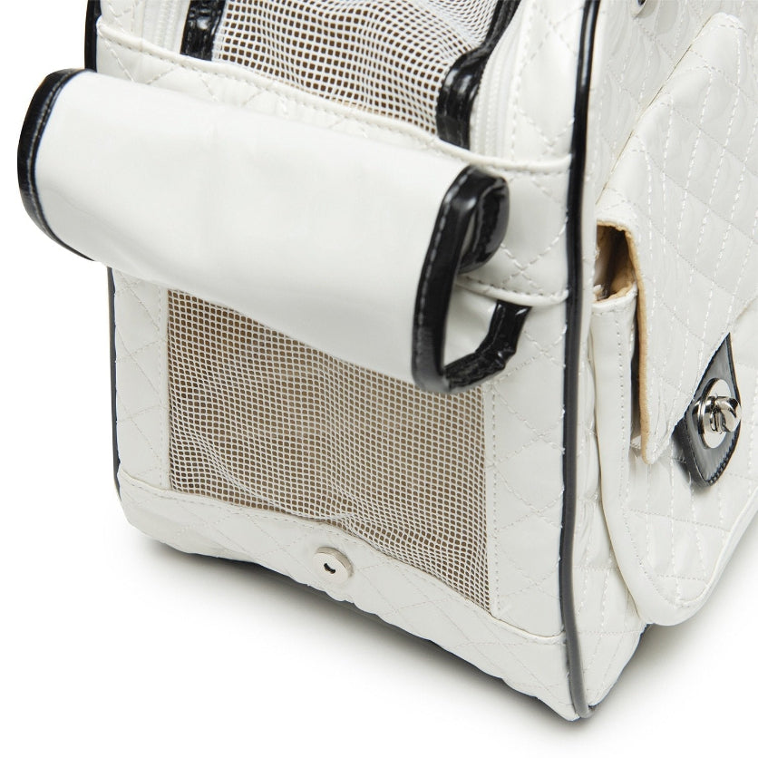 White pet carrier with mesh side on a white background