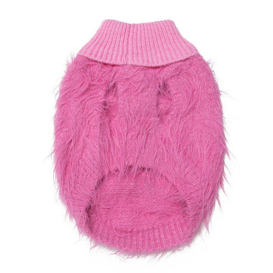 Woman wearing a trendy snowy pink short sleeve top shining in soft light