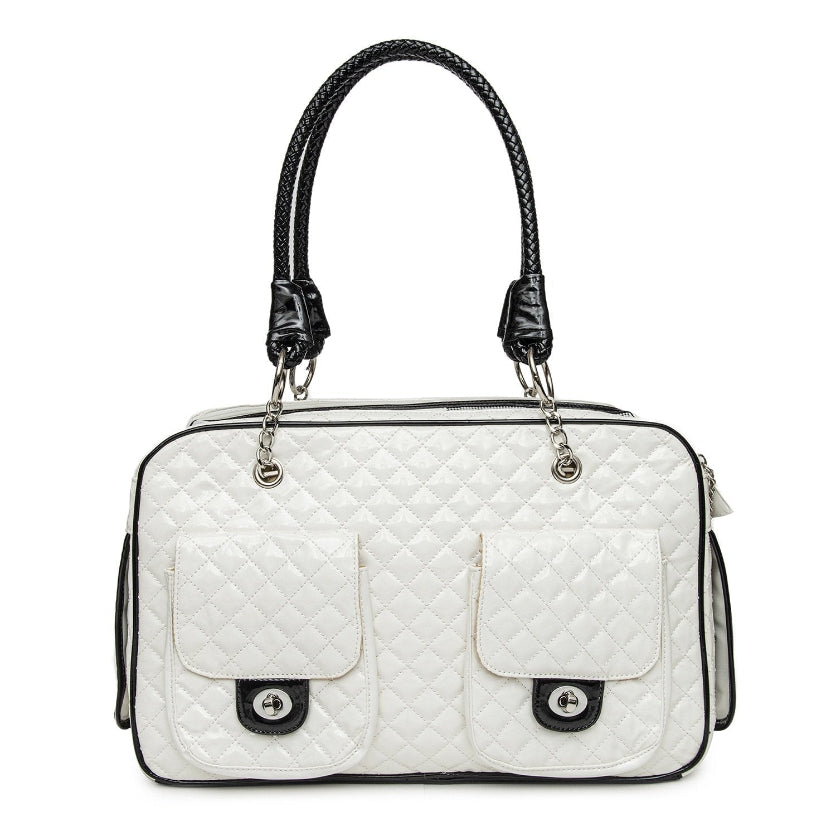 White quilted handbag with black accents on a white background